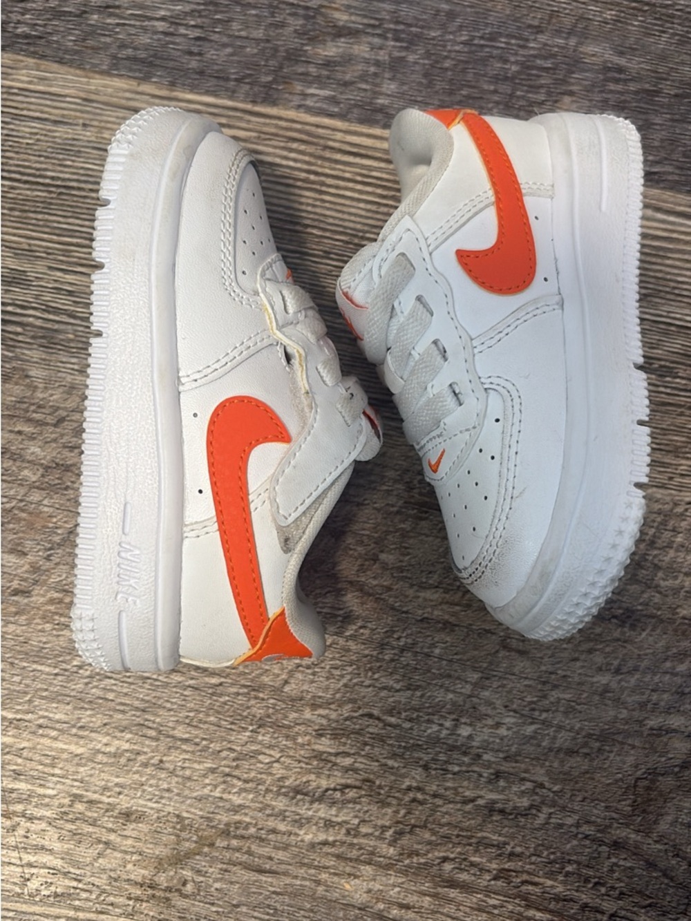 Nike Kids White Sneakers with Orange Swoosh